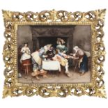 A late 19th century Berlin KPM porcelain plaque depicting a 17th century interior scene 'La Buena...