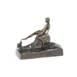 E.Wörner (German or Austrian, fl. early 20th century): A bronze study of a naked female sitting o...