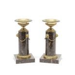 A pair of 19th century gilt bronze mounted Swedish porphyry tazza garniture