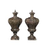 A pair of impressive Italian turned fossil marble pedestal urns and covers in the Baroque style