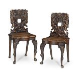 A pair of early Victorian walnut and oak hall chairs in the late 17th century style (2)