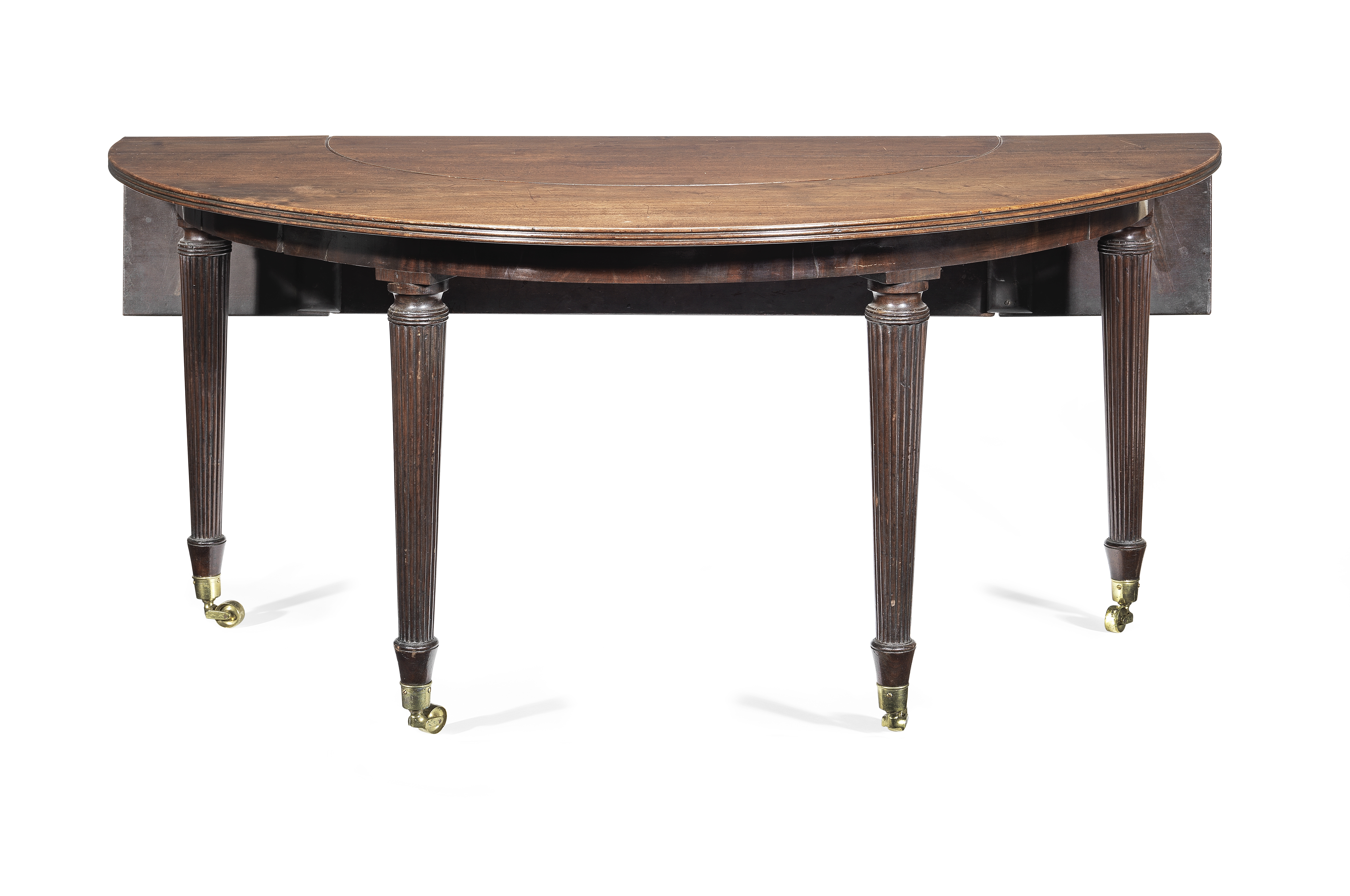 A Regency mahogany wine, hunt or social table in the manner of Gillows