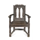 An interesting James VI/I oak caqueteuse open armchair, Scottish, circa 1600