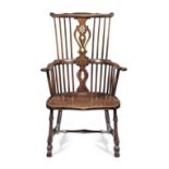 A George III walnut comb-back Windsor armchair, Thames Valley, circa 1820