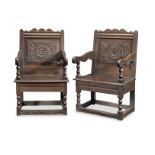 A pair of Charles II joined oak panel-back open armchairs, Cheshire, circa 1680 (2)