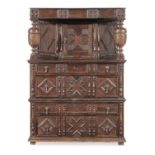 An unusual and possibly unique Charles II joined oak canted cupboard-on-chest, circa 1680
