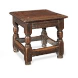 A rare Charles I padouk and oak low joint stool, circa 1630