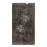 An unusual carved oak panel