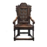 A Charles II joined oak panel-back open armchair Yorkshire, circa 1670