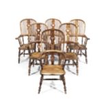 A good set of six Victorian yew, alder and elm broad-arm or smoker's bow high-back Windsor chairs...
