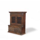 A rare Charles I joined and boarded oak, fruitwood and parquetry inlaid mural livery cupboard, We...