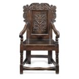 A William & Mary joined oak panel-back open armchair, Yorkshire, dated 1691