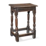 A mid-17th century oak joint stool, English, circa 1650