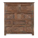 An exceptional and rare Henry VIII joined oak standing 'Great Hall' cupboard, circa 1540