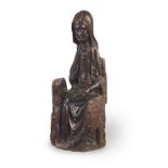 A rare 15th/early 16th century carved walnut figure, French, Saint Anne Teaching the Virgin to Read