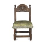 An unusual early 17th joined oak and upholstered backstool, dated 1618