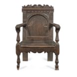 A rare Elizabeth I joined oak 'caqueteuse' open armchair, circa 1580