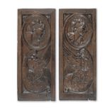 A pair of mid-16th century carved oak 'Romayne'-type panels, circa 1530-60 (2)