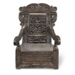A rare Charles II joined oak panel-back and box-seat child's open armchair, South-West Yorkshire,...