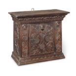 An interesting late 17th century boarded oak mural cupboard, Dutch