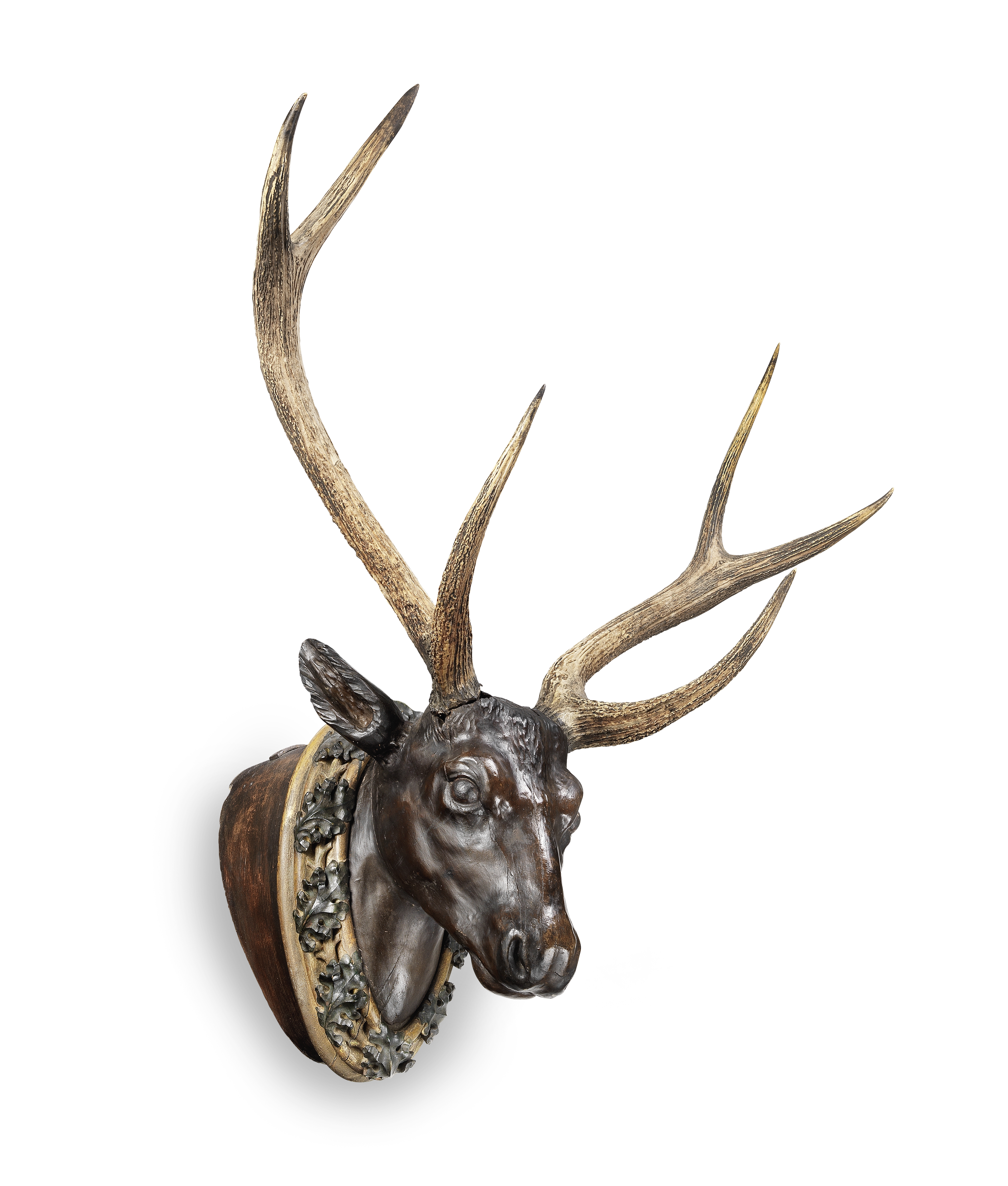 An impressive late 19th/early 20th century carved and painted deer's head, German/Austrian