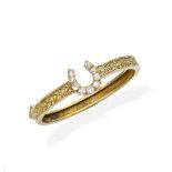 A gold and diamond bangle,