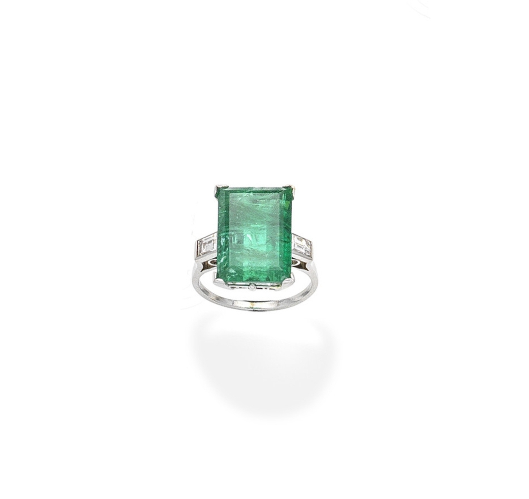 An emerald and diamond ring