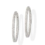 A pair of diamond hoop earrings