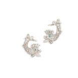 A pair of diamond and emerald dolphin earrings