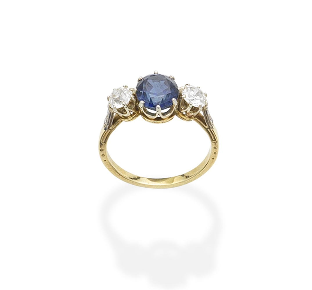 A sapphire and diamond three-stone ring