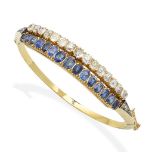 A late 19th century sapphire and diamond bangle