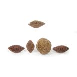 A small collection of carved peach stones and walnut shells 19th century (7)