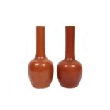 A pair of coral-red vases Bearing Kangxi six-character marks, but 19th century (2)