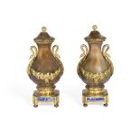 A pair of late 19th century gilt bronze mounted agate garniture urns and covers in the Louis XVI ...