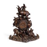 A late 19th century Swiss or South German carved and stained 'Black Forest,' mantel clock