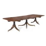 A mahogany triple pedestal dining table