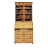 A late Victorian satinwood, amaranth and marquetry bureau bookcase of small proportions in the He...