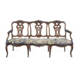 A Portuguese 18th century walnut triple chairback settee