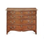 A George III mahogany serpentine commode