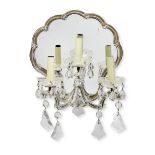 A set of four mid-20th century three light clear glass and mirrored girandoles probably Austrian ...