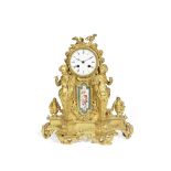 A late 19th century French gilt bronze figural and Serves style porcelain inset mantel clock in t...