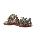 A remarkable parcel-gilt and enamelled silver model of a horse drawn carriage seemingly unmarked
