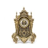 A late 19th century French gilt and patinated bronze mantle clock, in the Louis XIV style, the m...