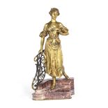 Edouard Drouot, (French, 1859-1945): A gilt bronze and rouge marble figure of a Belle Epoque maiden