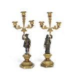A pair of Louis Philippe gilt bronze figural candlebra in the Troubadour style (2)