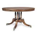 A Regency brass mounted rosewood and brass inlaid breakfast table
