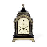 A good early 19th century ebonised and brass mounted miniature table clock with pull repeat in th...