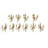 A set of ten French gilt bronze figural twin light appliques in the Louis XVI style, probably lat...