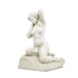 An early 20th century veined marble figure of a female nude kneeling on a rusticated base possibl...