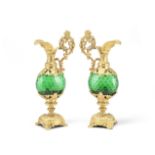 A pair of late 19th/early 20th century French gilt spelter and green glass ornamental garniture u...